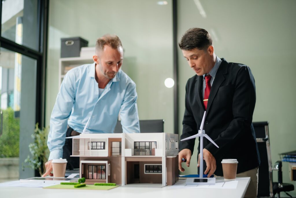 Meeting of architects, designers, and developers creating innovative, sustainable housing projects